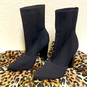 Sexy above the ankle leg hugging black boots..